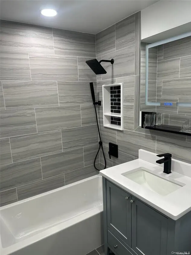 Bathroom with vanity and bathtub / shower combination Bathroom with vanity and bathtub / shower combination