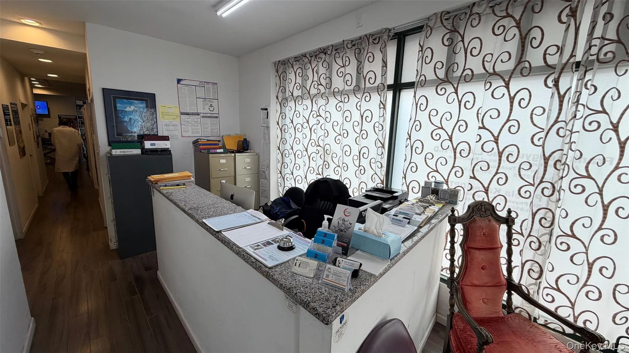 Office space featuring dark wood-type flooring Office space featuring dark wood-type flooring