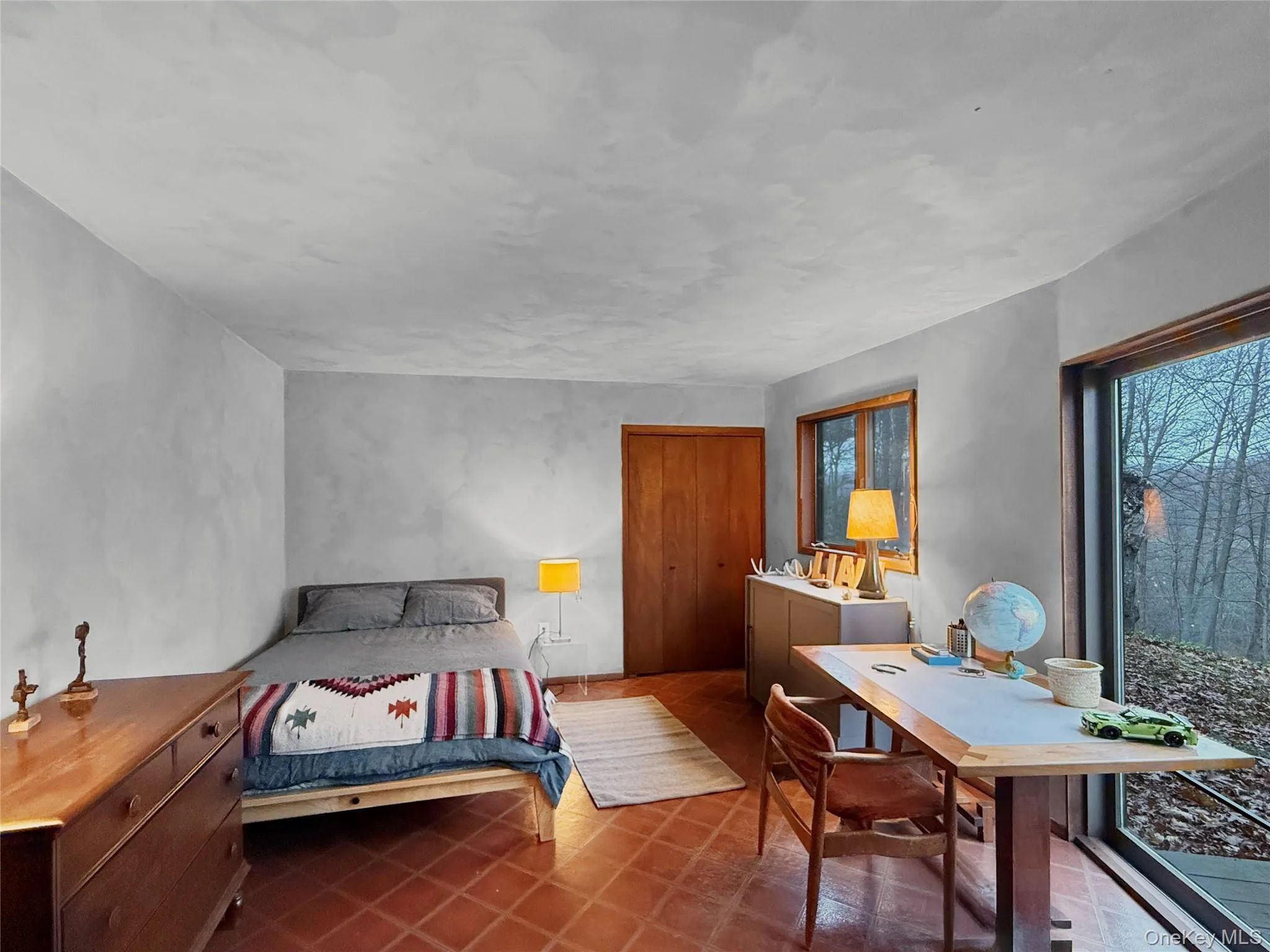 Bedroom on lower level with access to back yard Bedroom on lower level with access to back yard