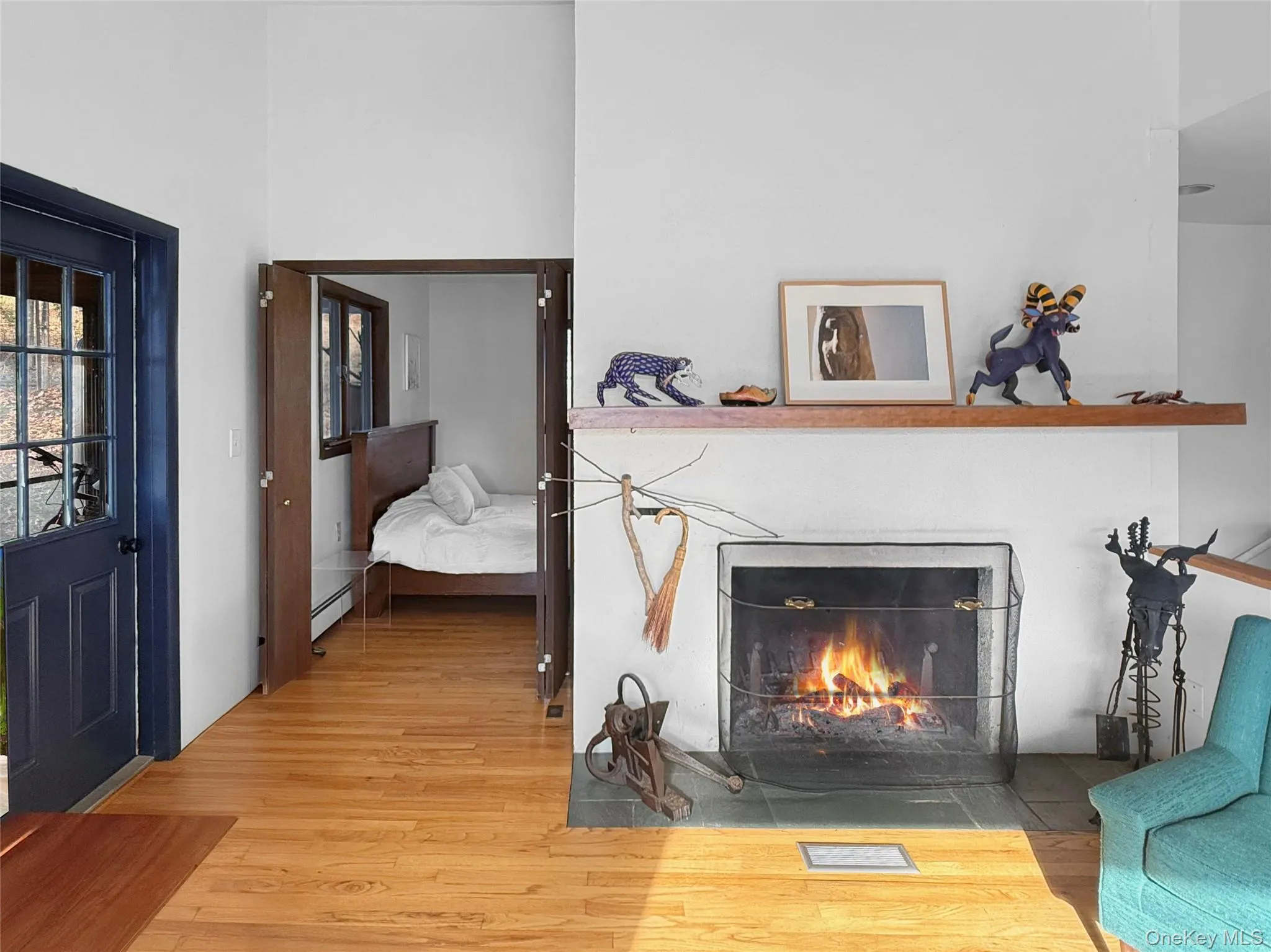 Wood burning fireplace with access to screened in porch & primary bedroom Wood burning fireplace with access to screened in porch & primary bedroom