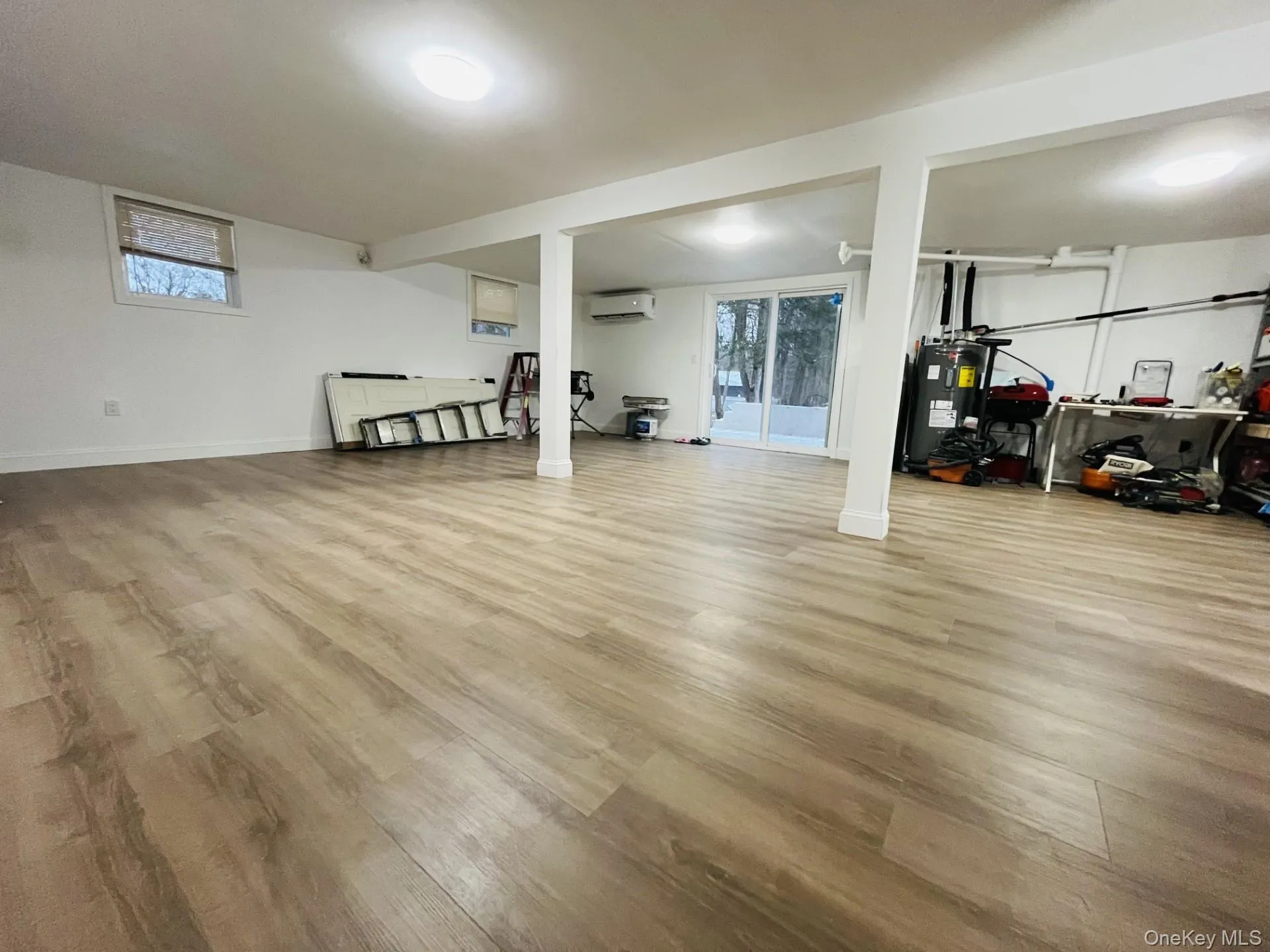 Large basement with light wood finished floors Large basement with light wood finished floors