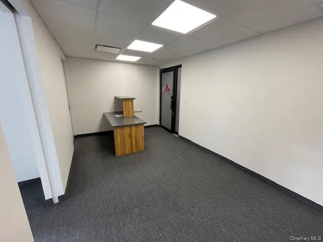 Unfurnished office with a paneled ceiling Unfurnished office with a paneled ceiling