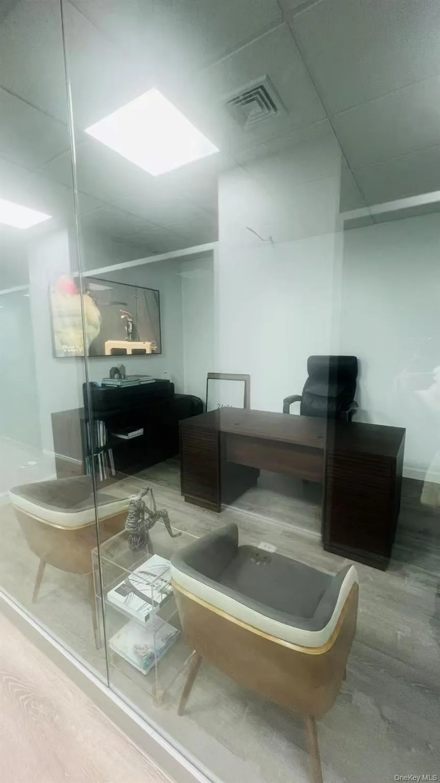 Bathroom with vanity, a stall shower, and wood finished floors Bathroom with vanity, a stall shower, and wood finished floors