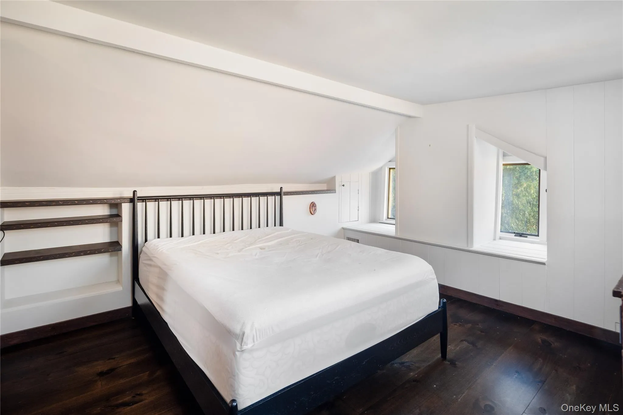 Upper level bedroom with spectacular dark wood wide plank flooring Upper level bedroom with spectacular dark wood wide plank flooring