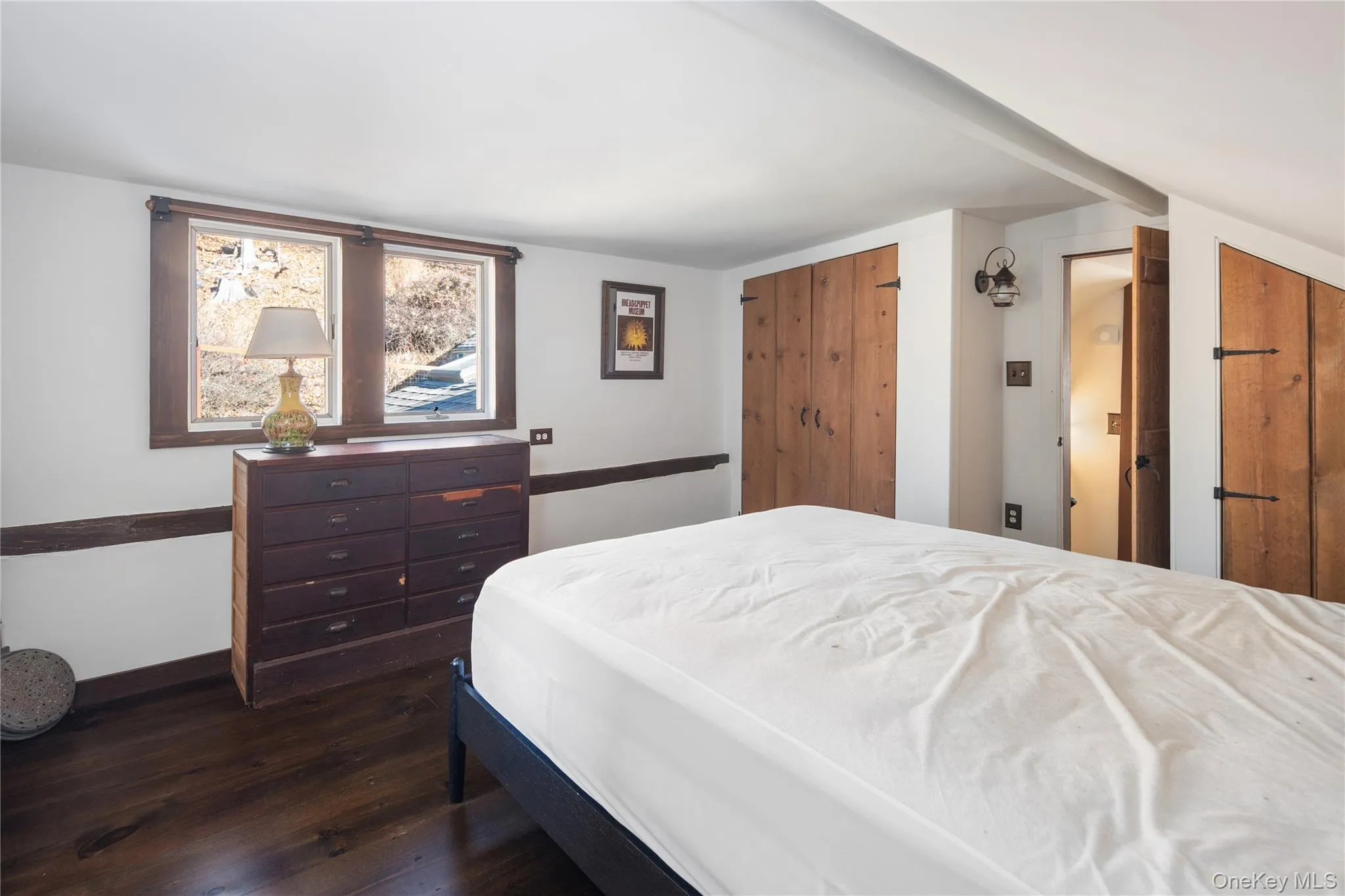 Upper level bedroom with spectacular dark wood wide plank flooring Upper level bedroom with spectacular dark wood wide plank flooring
