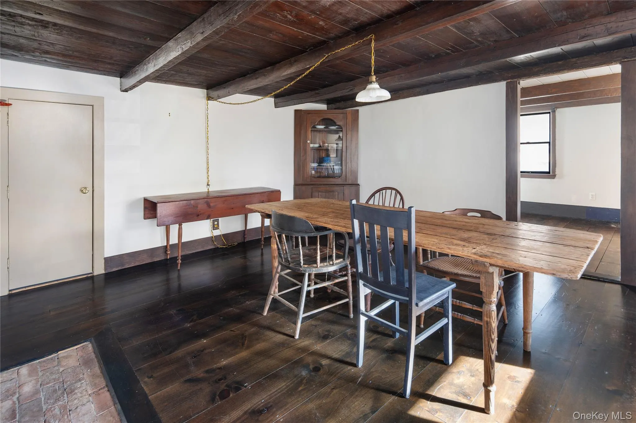 Living room / den off main level entryway with original wooden built-in Living room / den off main level entryway with original wooden built-in