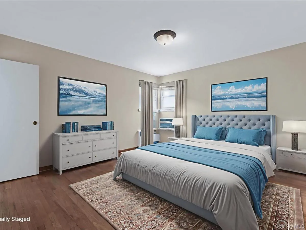 Primary Bedroom featuring dark wood finished floors Primary Bedroom featuring dark wood finished floors