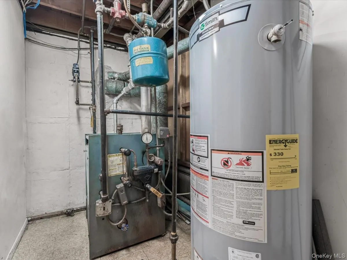 Utilities featuring gas water heater and a heating unit Utilities featuring gas water heater and a heating unit