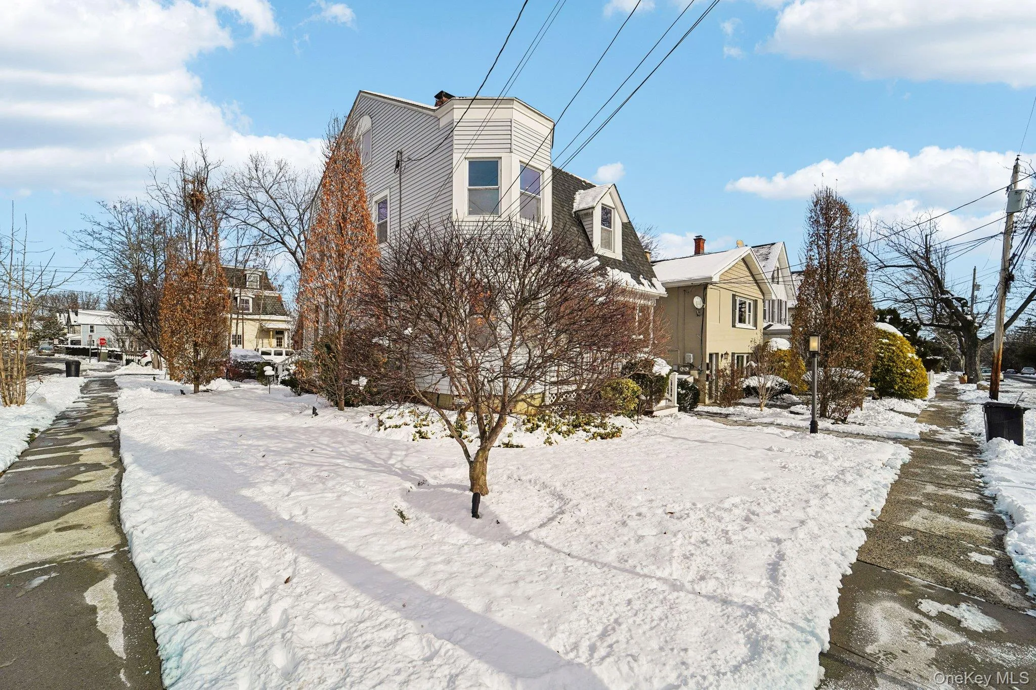View of snowy exterior featuring a residential view View of snowy exterior featuring a residential view