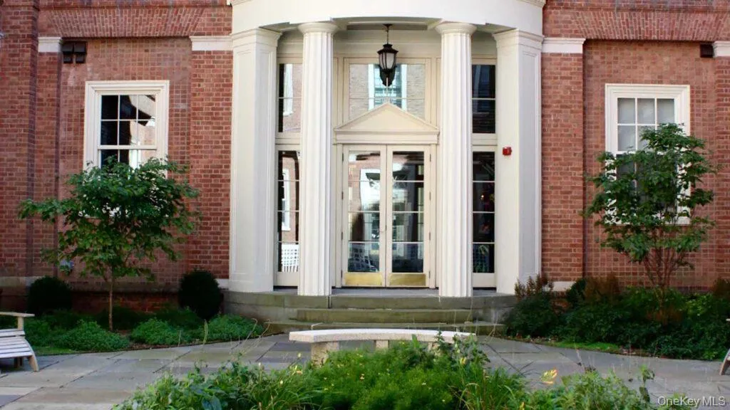View of exterior entry with french doors and brick siding View of exterior entry with french doors and brick siding