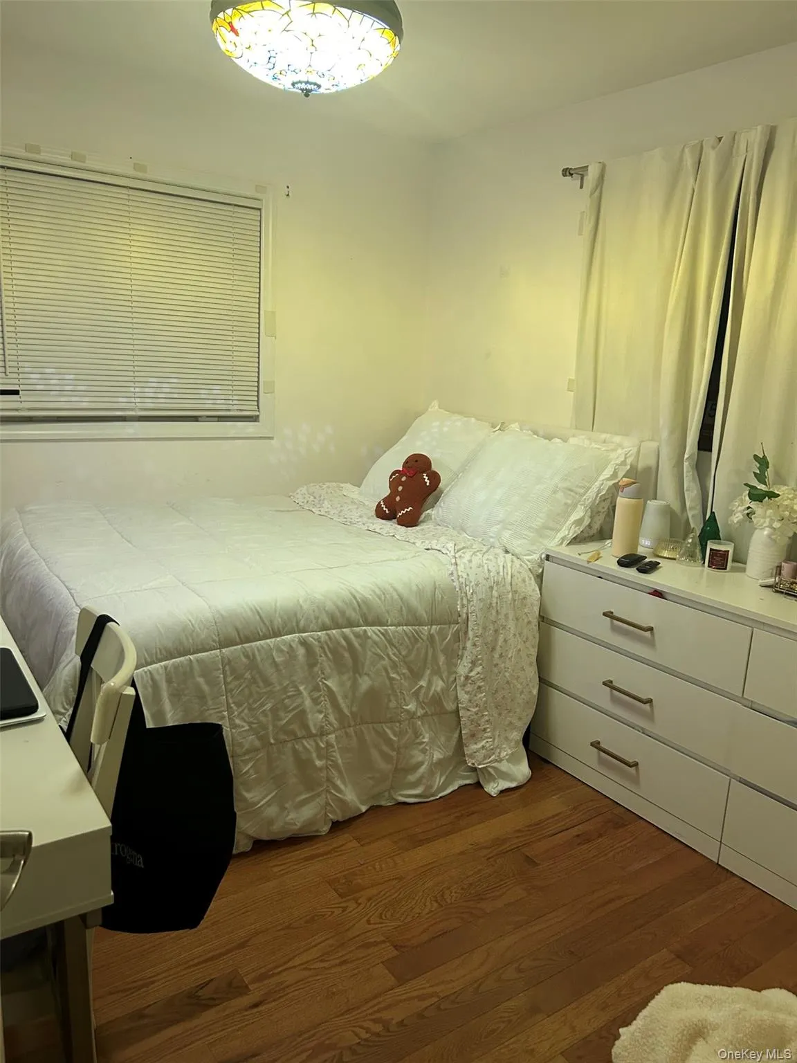 Bedroom featuring dark wood finished floors Bedroom featuring dark wood finished floors