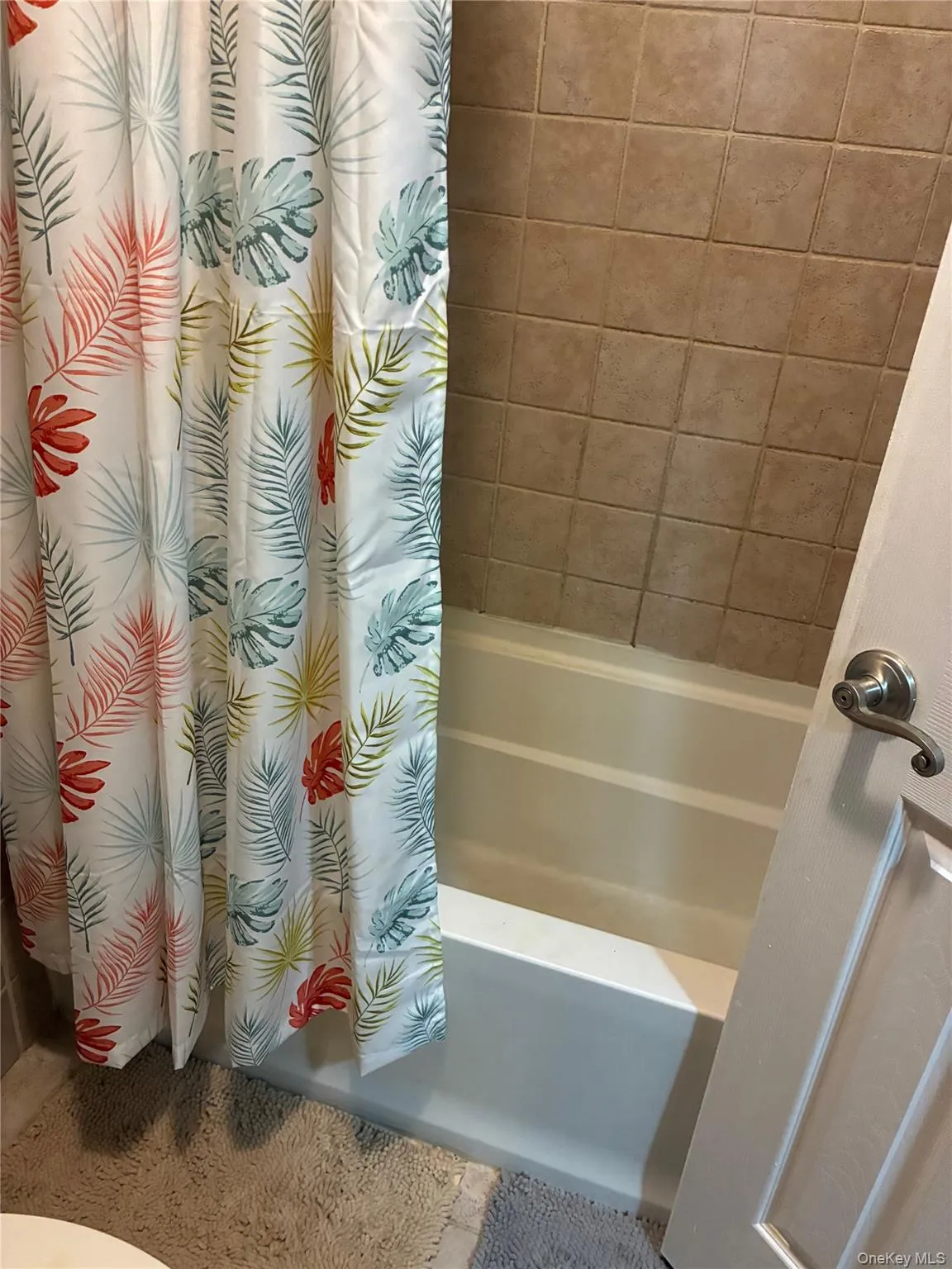 Bathroom featuring shower / bath combination with curtain Bathroom featuring shower / bath combination with curtain