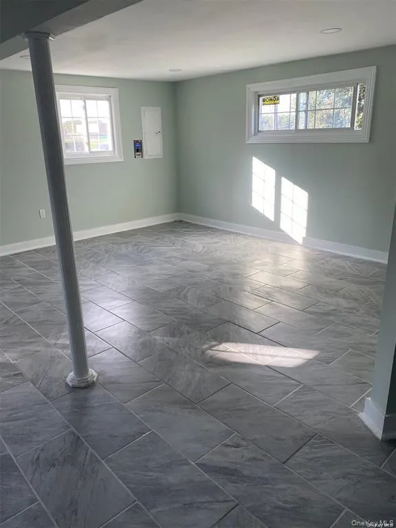 Unfurnished room with baseboards Unfurnished room with baseboards