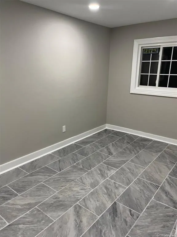 Empty room featuring baseboards Empty room featuring baseboards