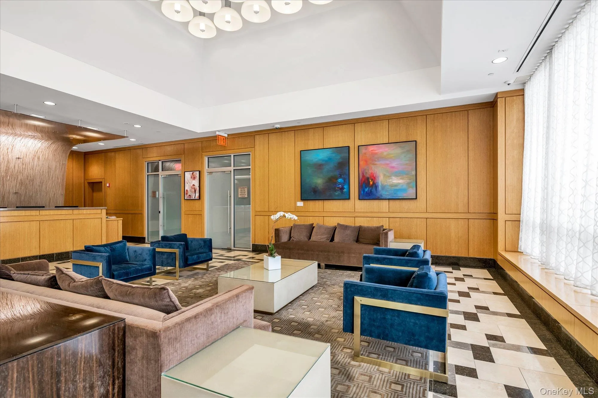 Community lobby with recessed lighting and wood walls Community lobby with recessed lighting and wood walls