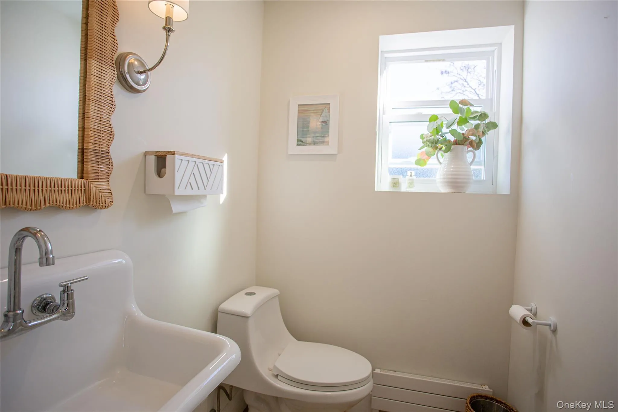 Half bath featuring a sink and toilet Half bath featuring a sink and toilet