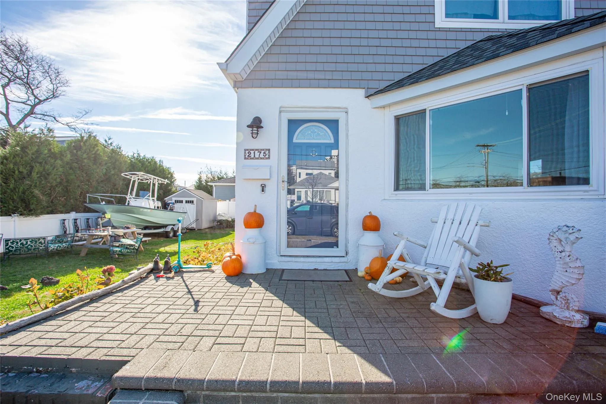 Property entrance featuring a patio area and stucco siding Property entrance featuring a patio area and stucco siding