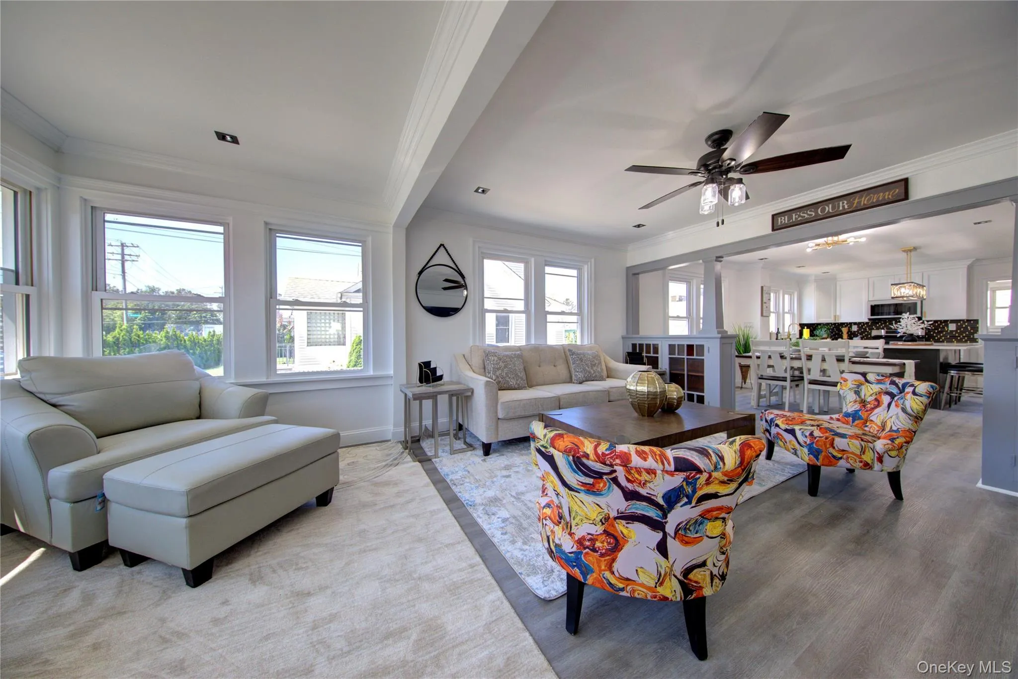 Living area with crown molding and ceiling fan Living area with crown molding and ceiling fan