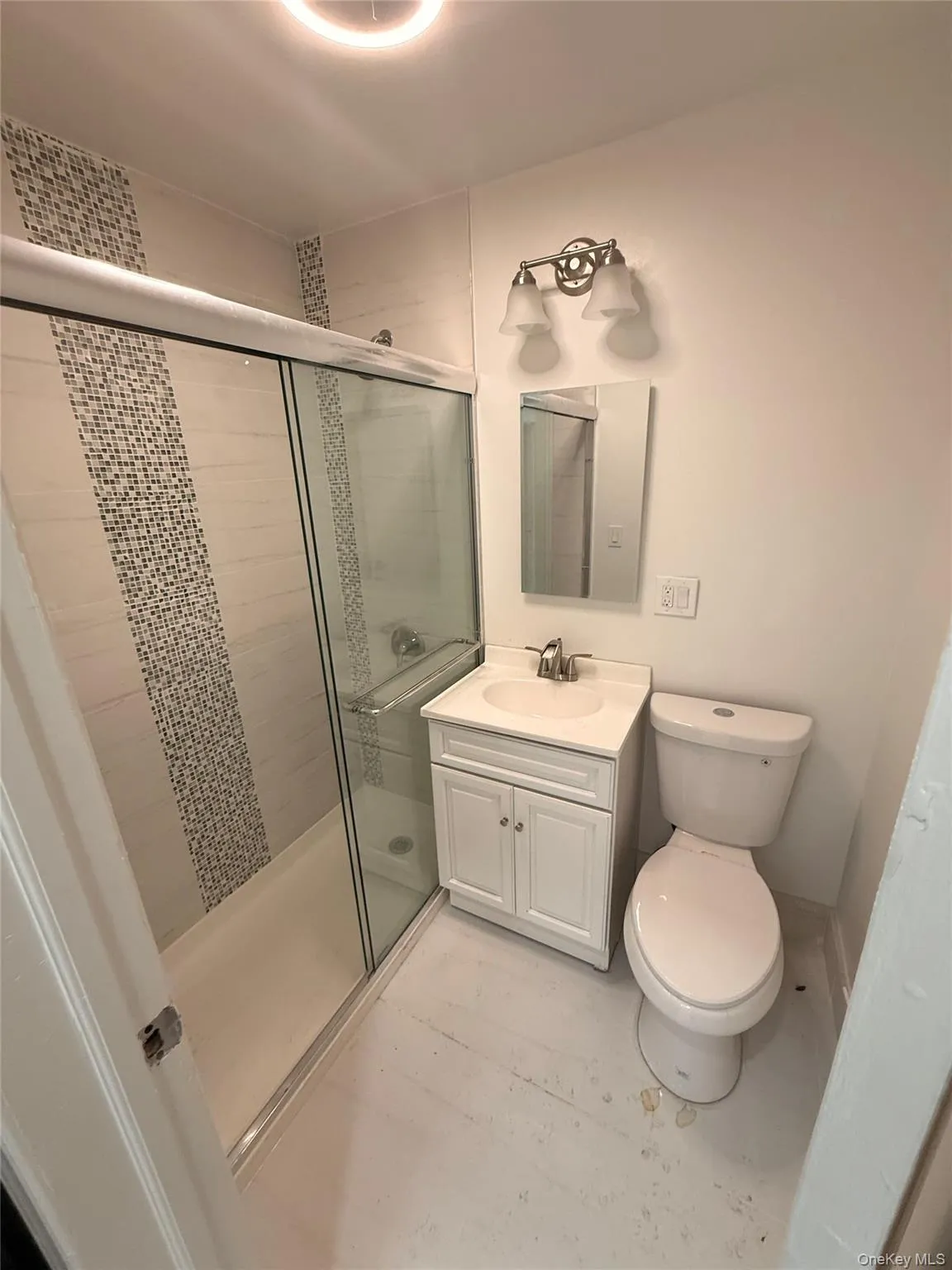 Bathroom with a stall shower and vanity Bathroom with a stall shower and vanity