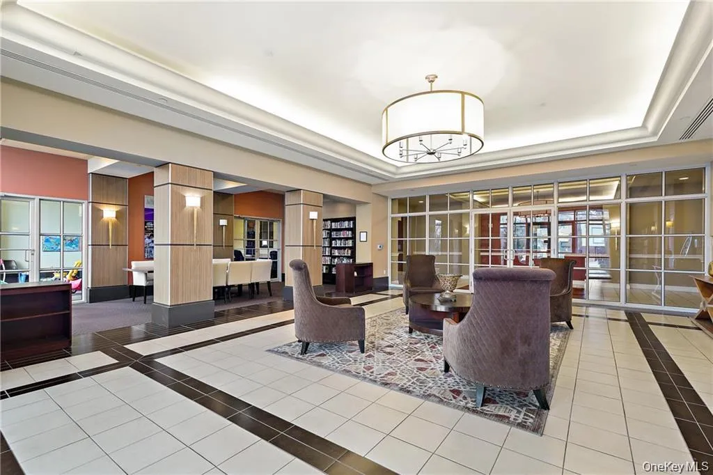 Lounge area featuring a library and conference area Lounge area featuring a library and conference area