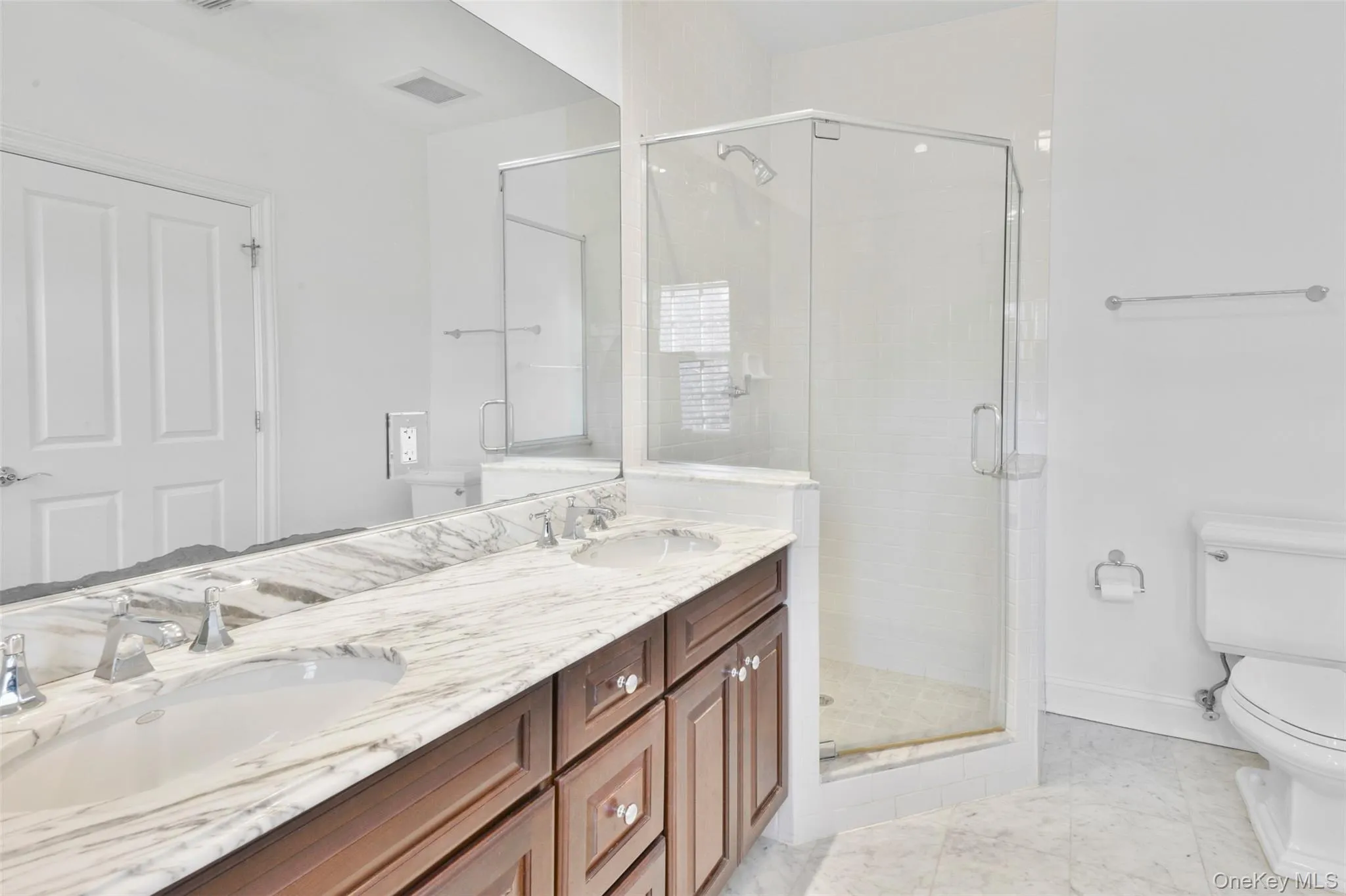 Bathroom with a stall shower and double vanity Bathroom with a stall shower and double vanity