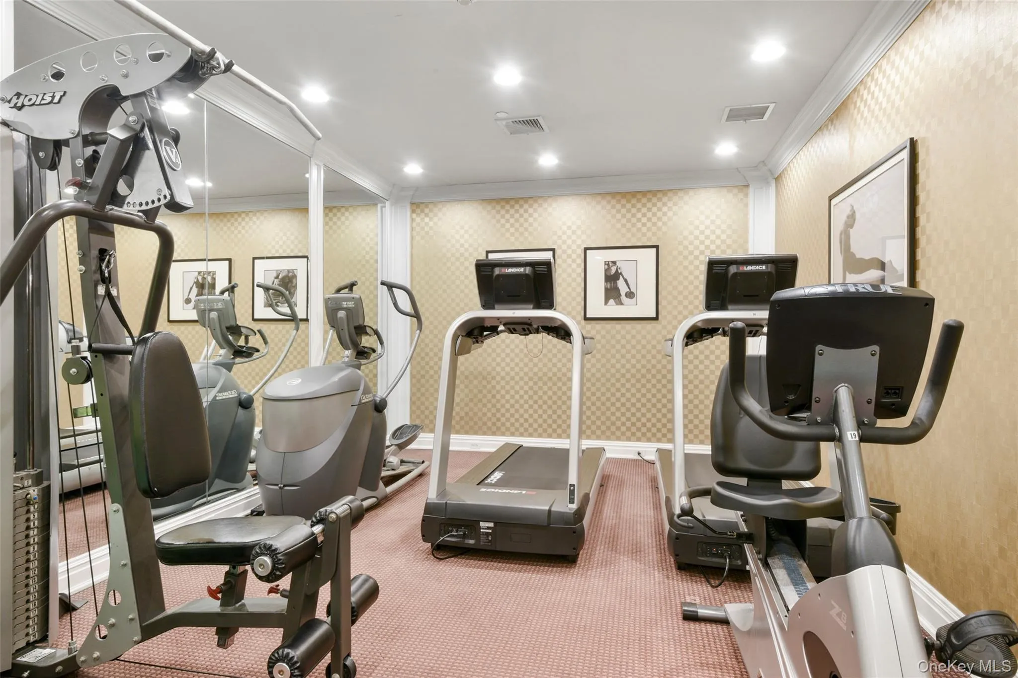 Exercise area featuring wallpapered walls, crown molding, and recessed lighting Exercise area featuring wallpapered walls, crown molding, and recessed lighting