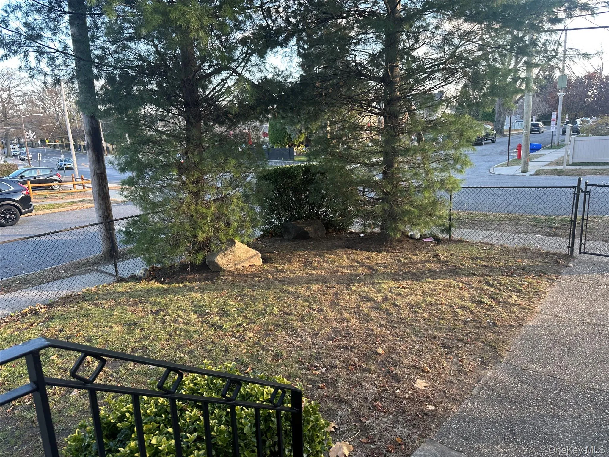View of yard featuring a gate View of yard featuring a gate