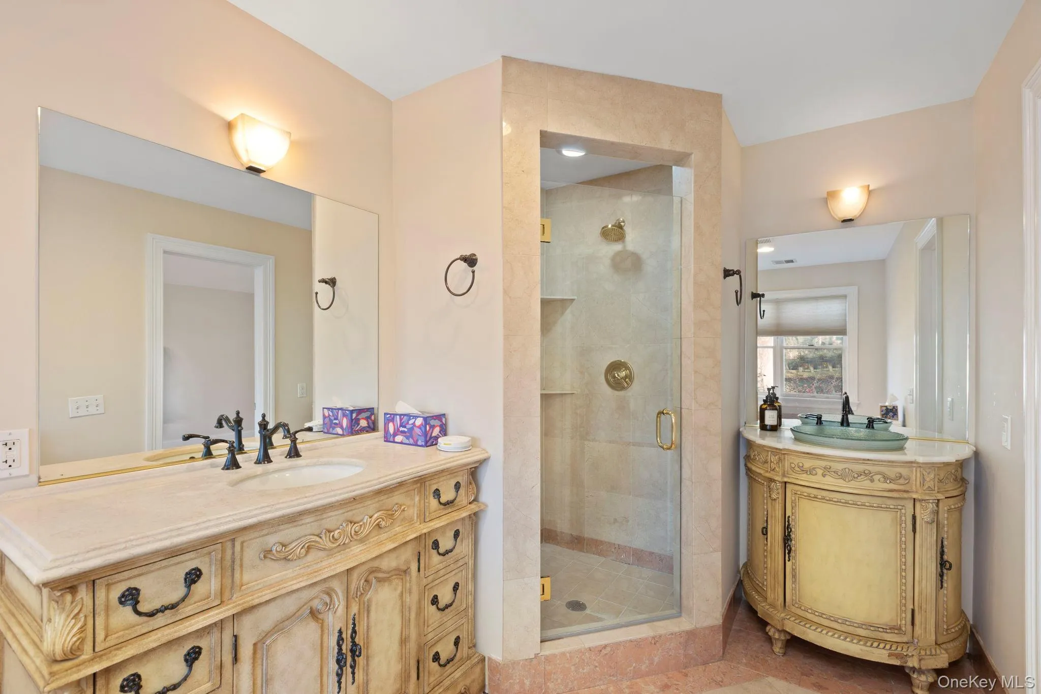 Full bathroom featuring vanity, a shower stall, and tile patterned flooring Full bathroom featuring vanity, a shower stall, and tile patterned flooring