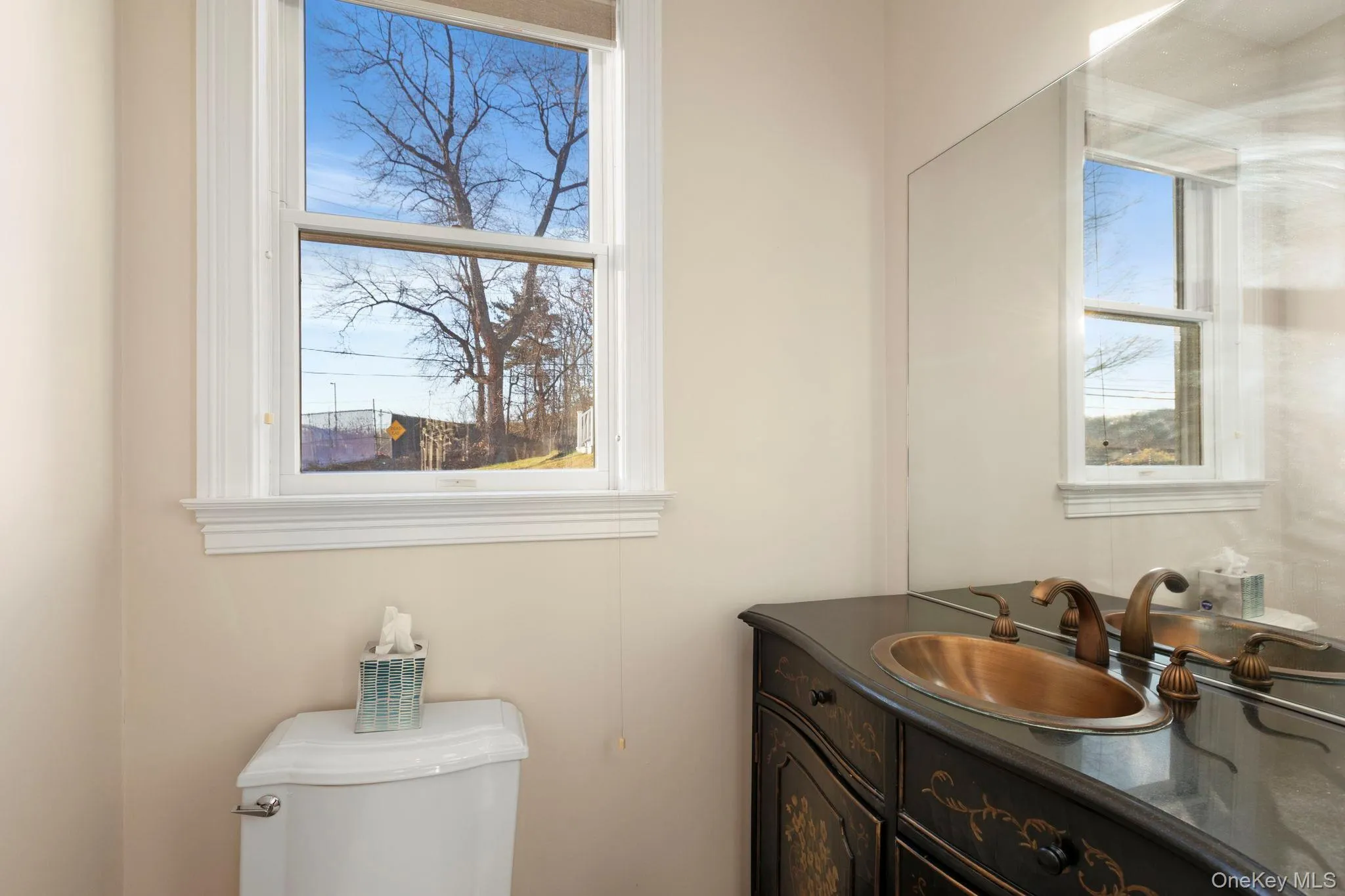 Half bathroom with vanity and toilet Half bathroom with vanity and toilet