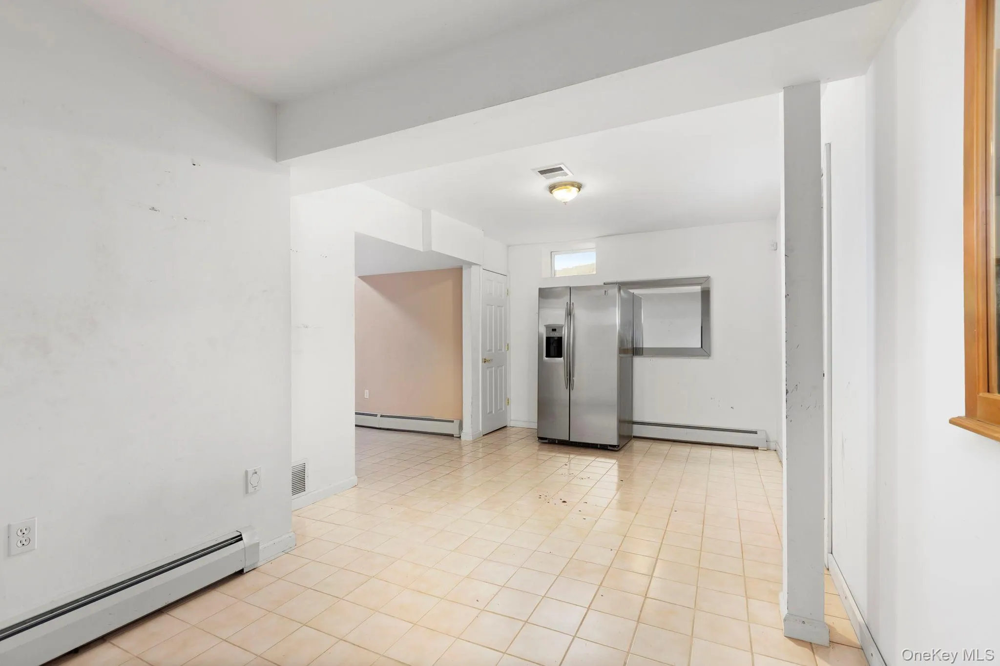 Empty room featuring baseboard heating Empty room featuring baseboard heating