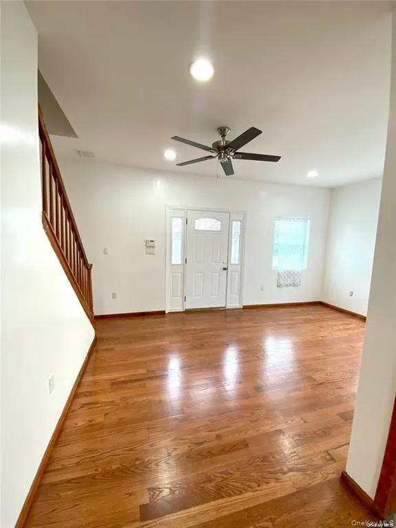 Entryway with light wood finished floors, recessed lighting, healthy amount of natural light, a ceiling fan, and stairway Entryway with light wood finished floors, recessed lighting, healthy amount of natural light, a ceiling fan, and stairway