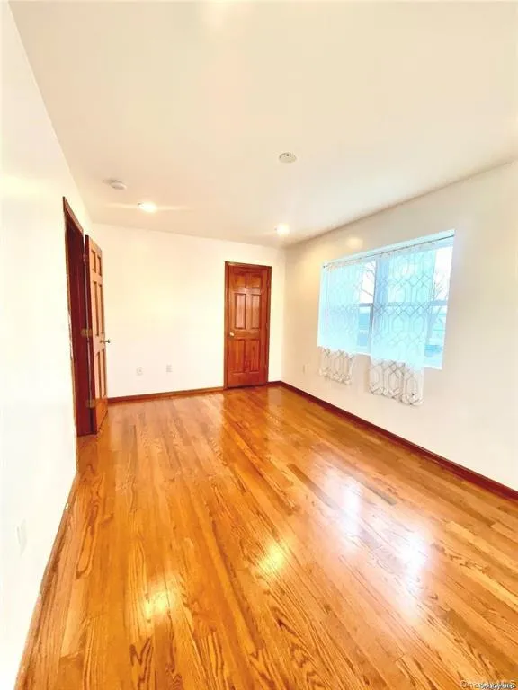Unfurnished room with light wood-type flooring and recessed lighting Unfurnished room with light wood-type flooring and recessed lighting
