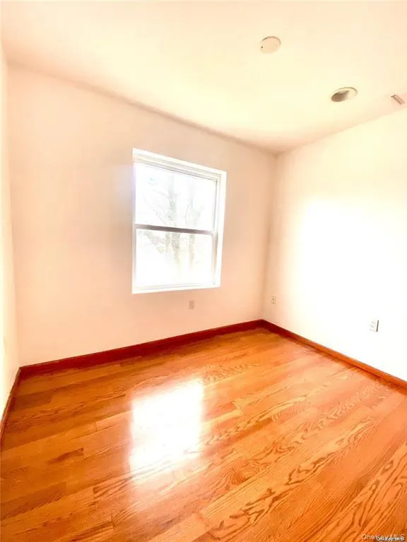 Spare room with light wood-style flooring Spare room with light wood-style flooring