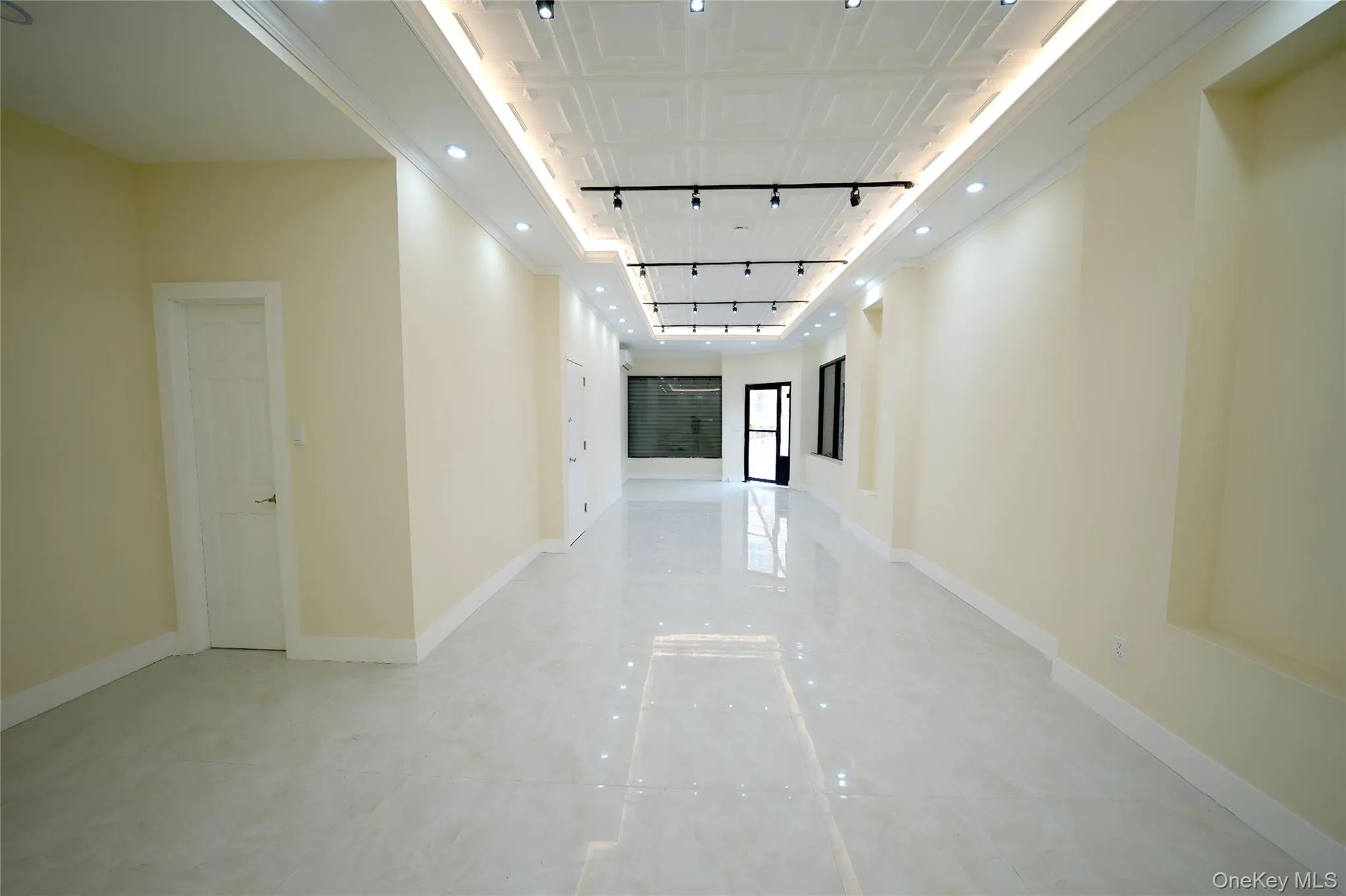 Hallway with recessed lighting and track lighting Hallway with recessed lighting and track lighting
