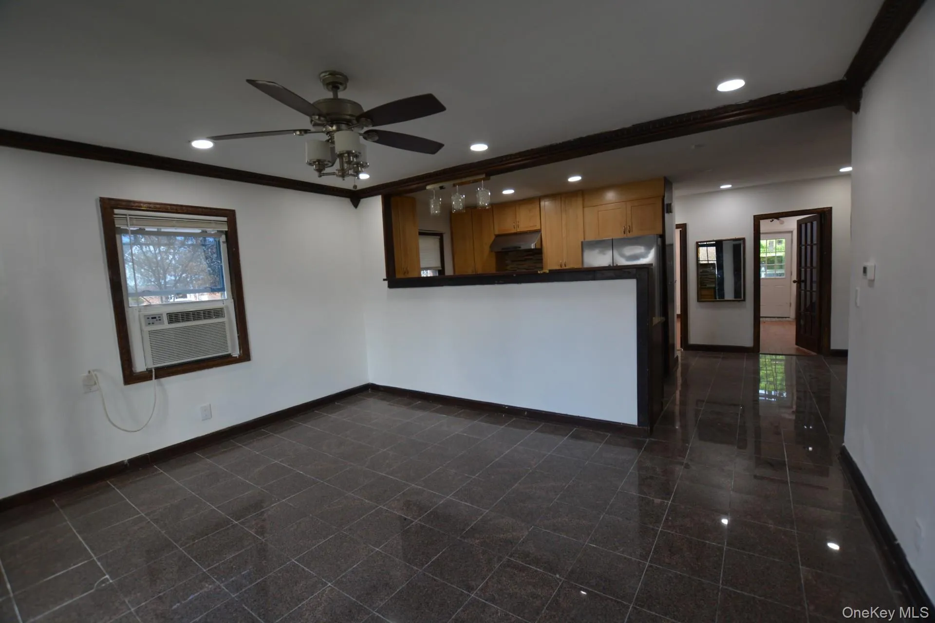 Unfurnished living room featuring crown molding, recessed lighting, and ceiling fan Unfurnished living room featuring crown molding, recessed lighting, and ceiling fan