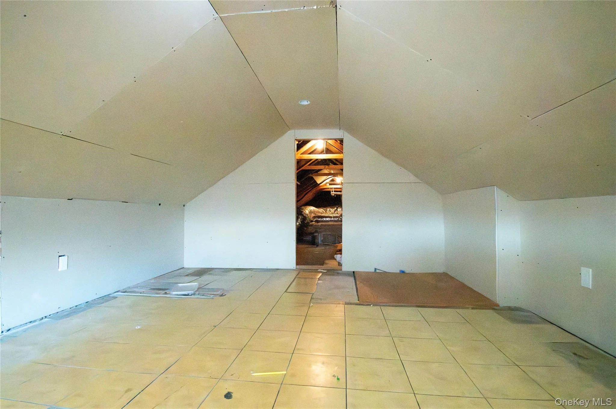 Additional living space featuring vaulted ceiling Additional living space featuring vaulted ceiling