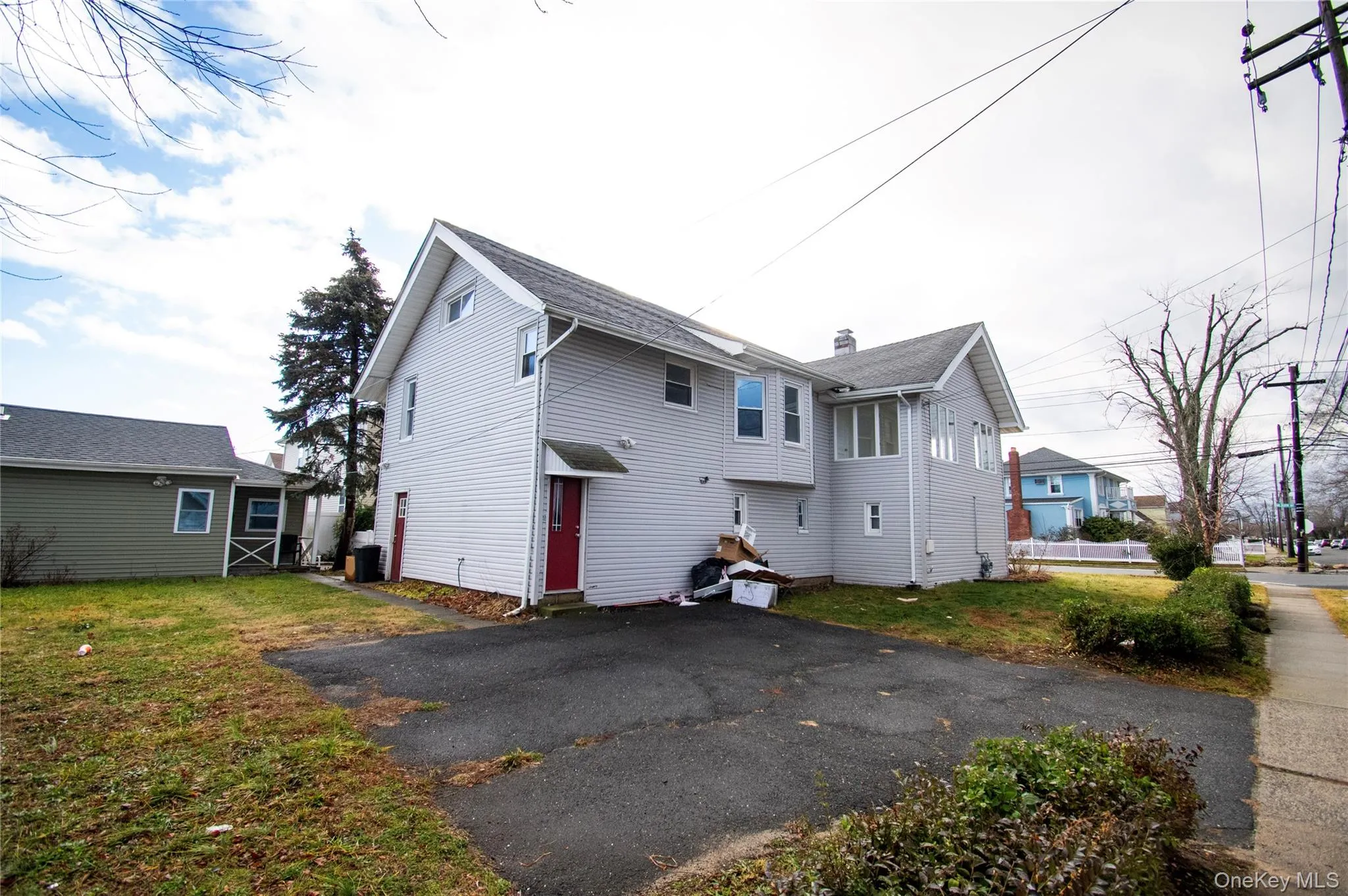 Rear view of house featuring a lawn Rear view of house featuring a lawn