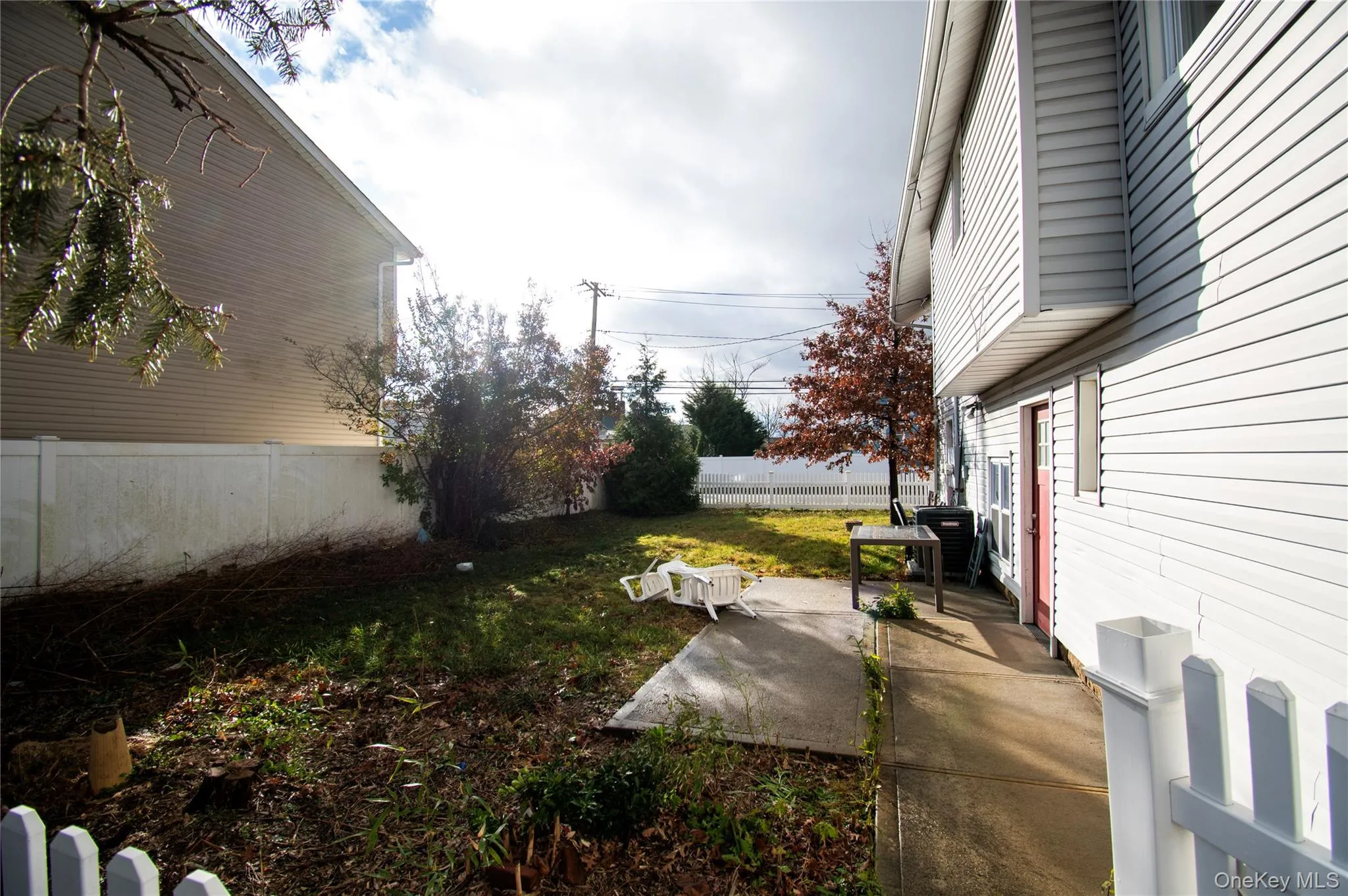 Fenced backyard featuring a patio area Fenced backyard featuring a patio area