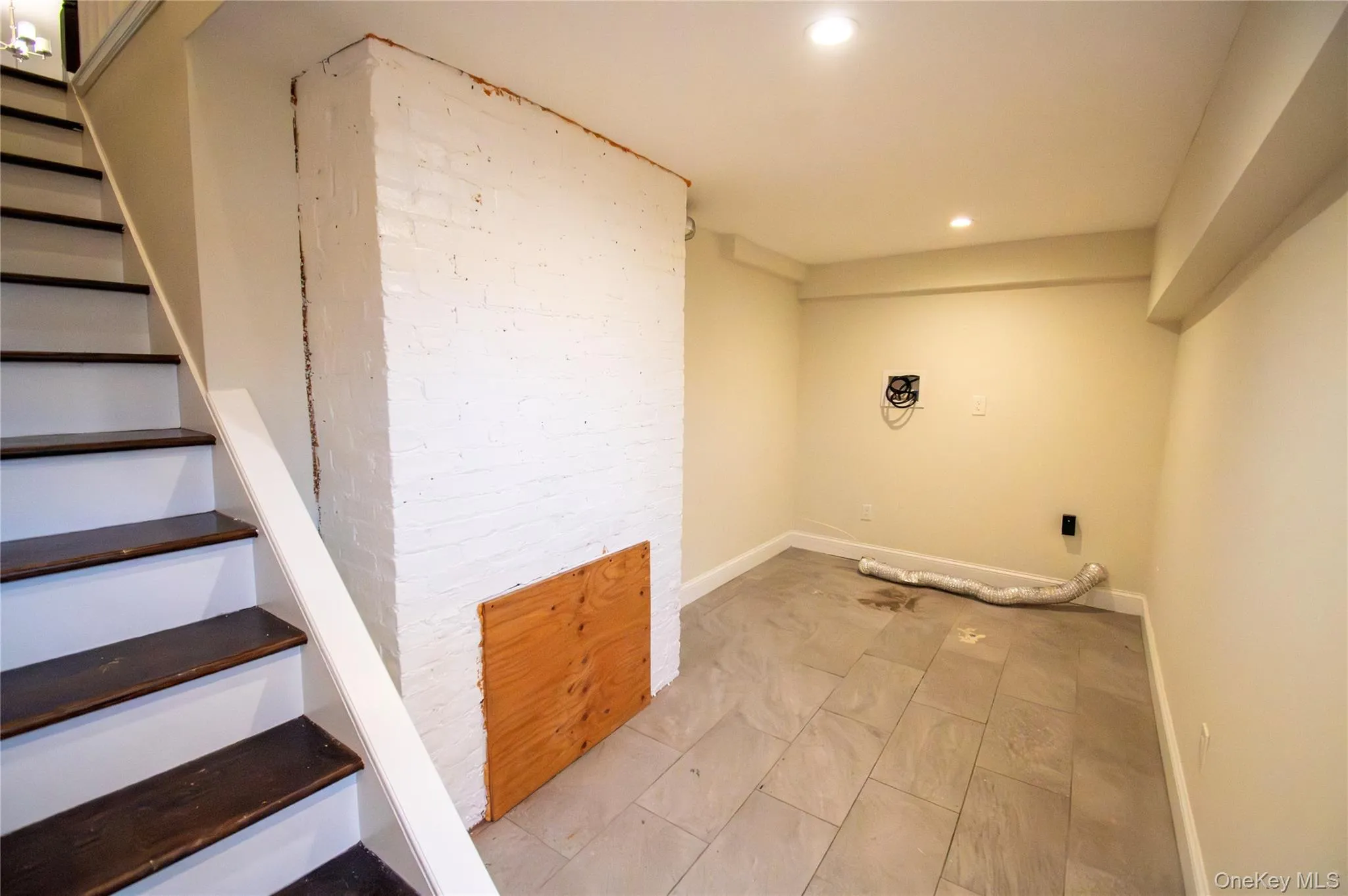 Laundry room with recessed lighting and baseboards Laundry room with recessed lighting and baseboards