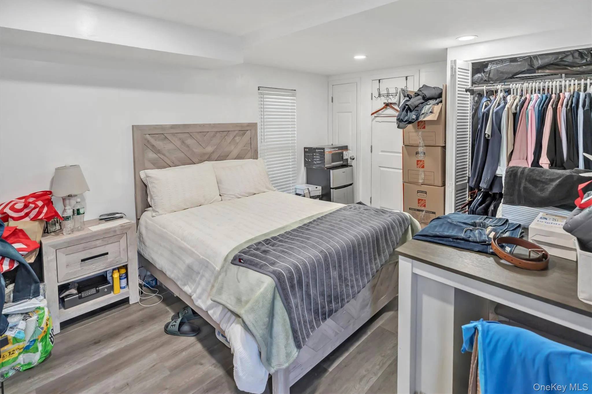 Bedroom featuring a closet, light wood-type flooring, and recessed lighting Bedroom featuring a closet, light wood-type flooring, and recessed lighting