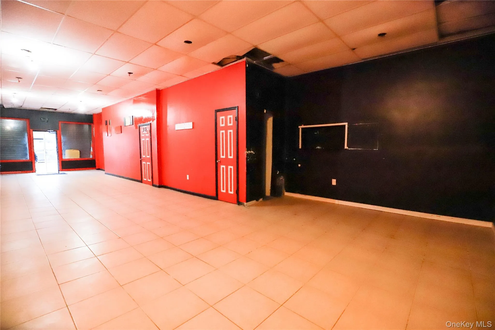 Spare room featuring a drop ceiling Spare room featuring a drop ceiling