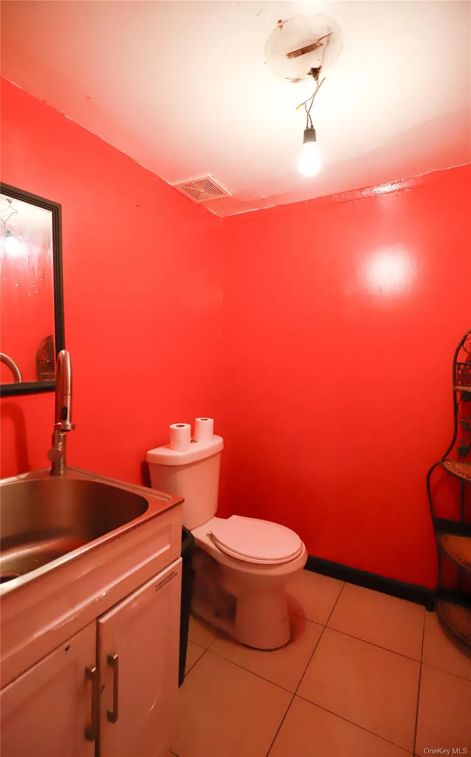 Bathroom with vanity and light tile patterned floors Bathroom with vanity and light tile patterned floors