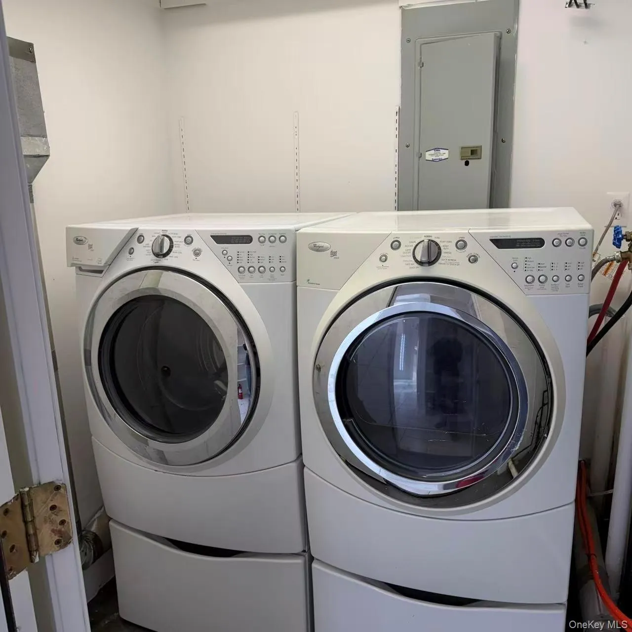 Washroom featuring electric panel and independent washer and dryer Washroom featuring electric panel and independent washer and dryer