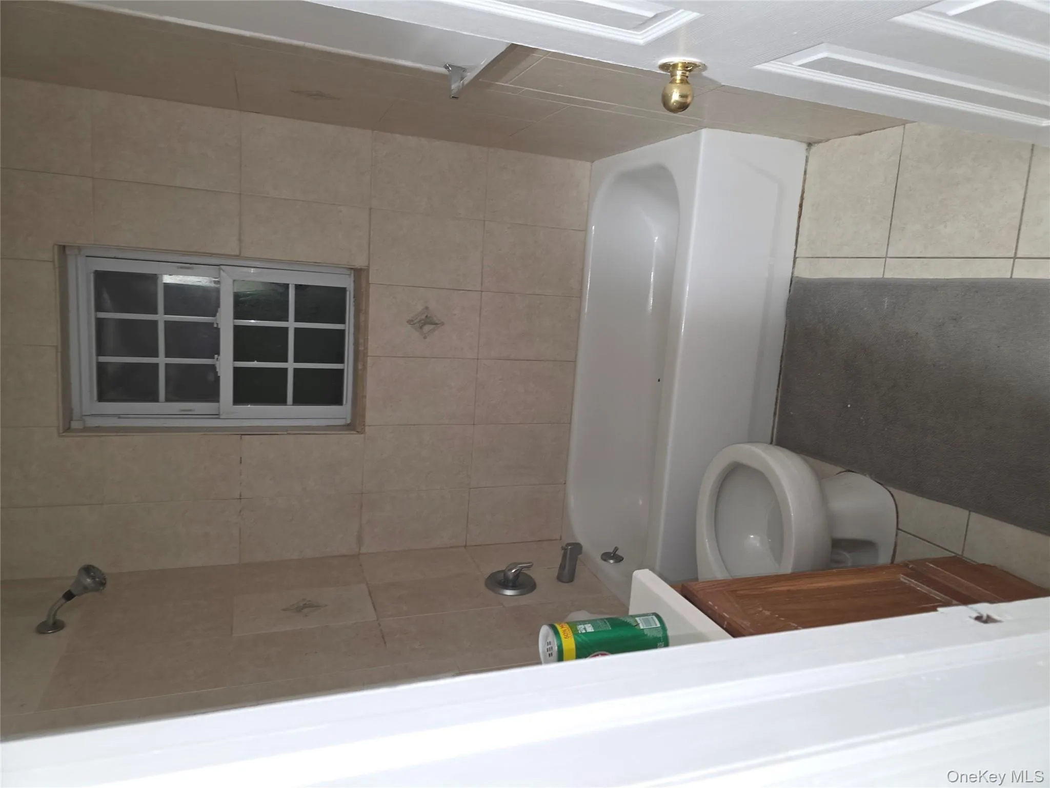 Full bathroom featuring vanity, light tile patterned flooring, and shower / washtub combination Full bathroom featuring vanity, light tile patterned flooring, and shower / washtub combination
