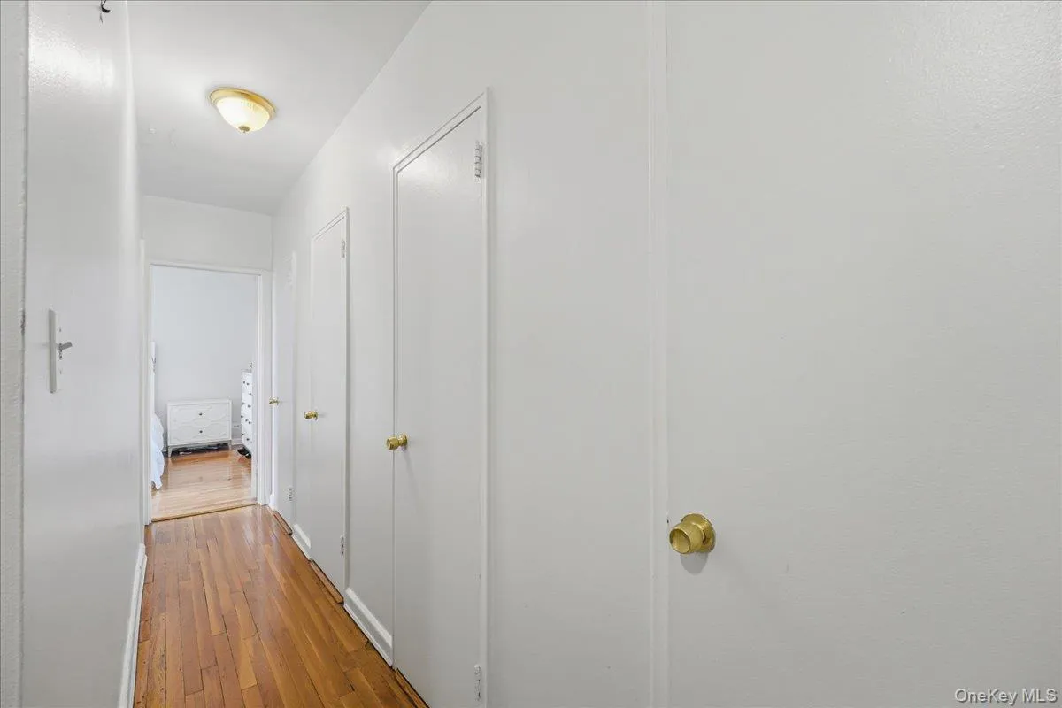 Hall featuring light wood-style flooring Hall featuring light wood-style flooring