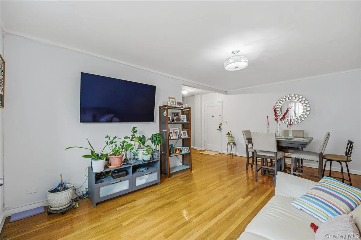 Living room with light wood-type flooring and baseboards Living room with light wood-type flooring and baseboards