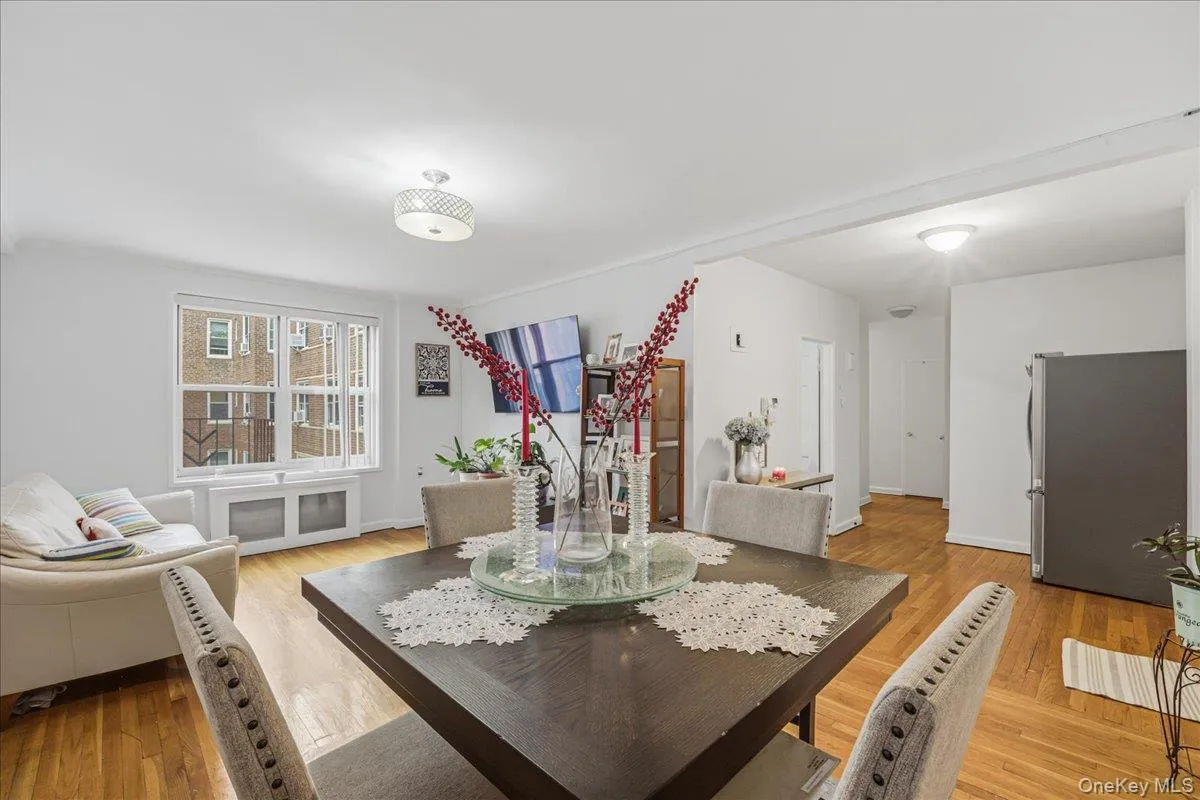 Dining space featuring light wood finished floors and radiator heating unit Dining space featuring light wood finished floors and radiator heating unit