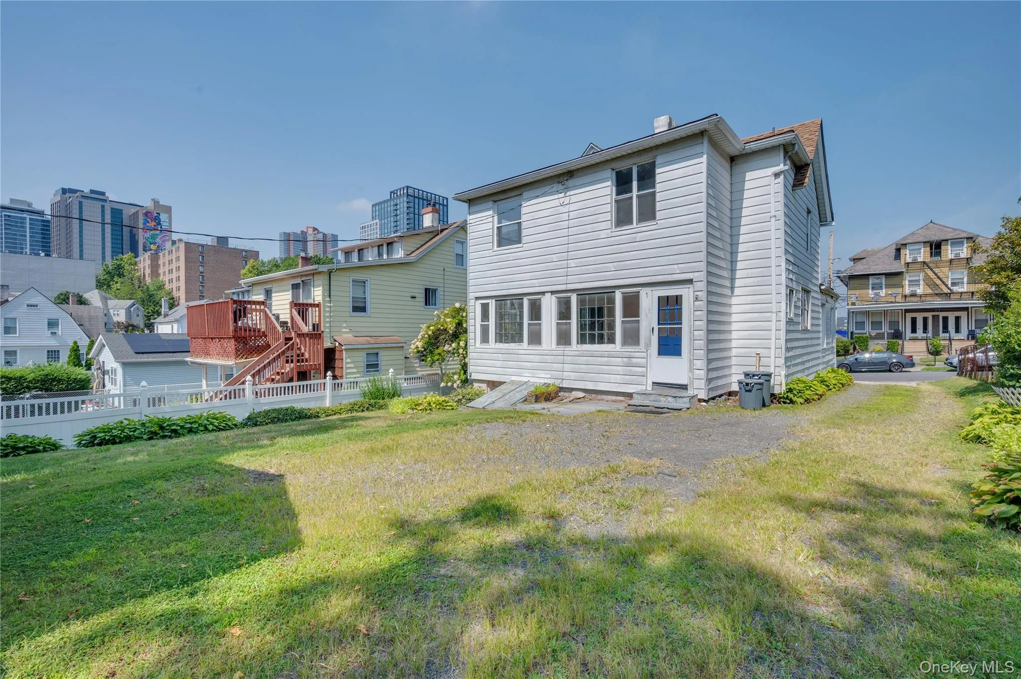 Back of house featuring a deck Back of house featuring a deck