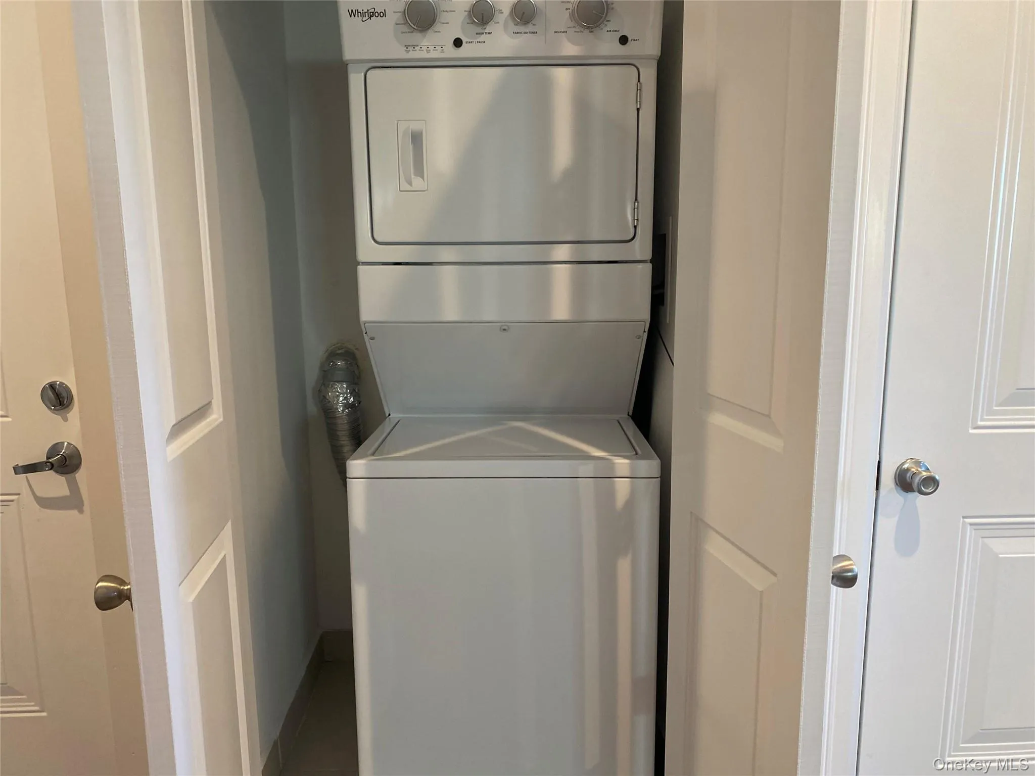 Washroom featuring estacked washer and dryer Washroom featuring estacked washer and dryer