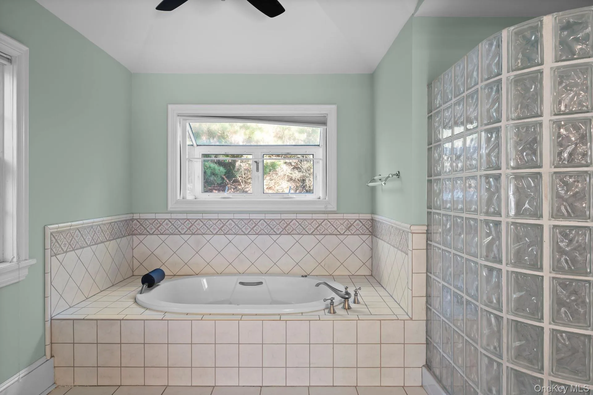 Bathroom featuring a garden tub Bathroom featuring a garden tub